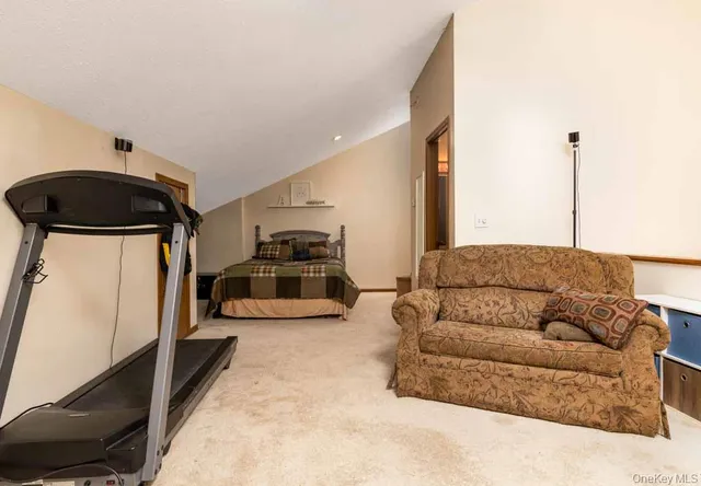a living room with furniture and a ceiling fan