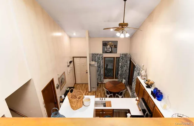 a view of living room with furniture and a chandelier