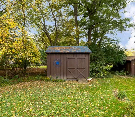 a wooden fence with some trees in the background