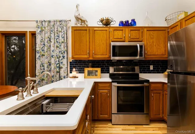 a kitchen that has a sink and a stove