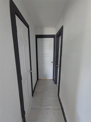 an entryway door with a hallway