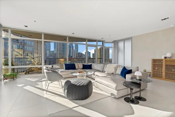 a living room with furniture and a large window