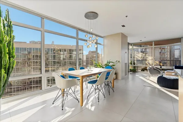 a view of a dining room with furniture window and outside view