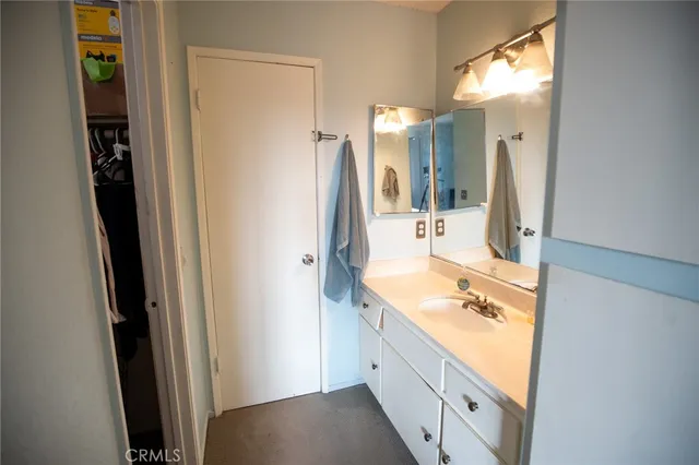 a bathroom with a sink a vanity and mirror