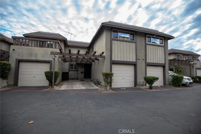a view of a house with a street
