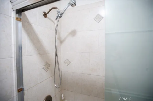 a bathroom with a sink vanity and mirror