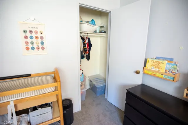 a bedroom with a bed and a table in it