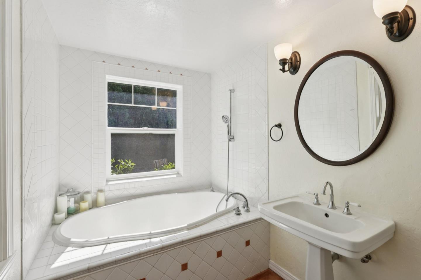 122 Strawberry Road Watsonville, CA 95076 - Photo 28 of 57 a bathroom with a sink and a mirror