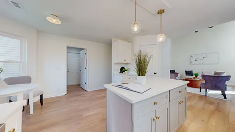 a view of kitchen island with stainless steel appliances