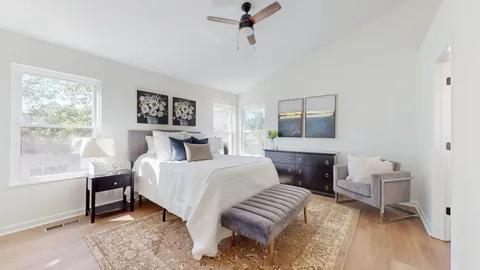 a bedroom with a bed and a table