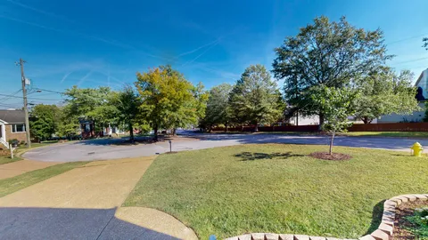 a view of a swimming pool with an outdoor space and seating area