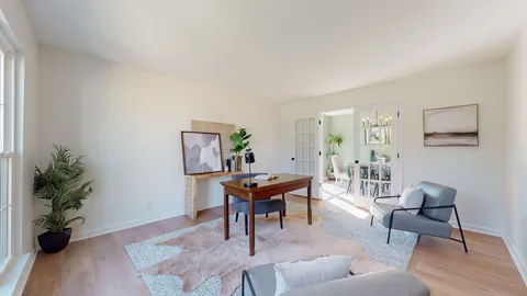 a workspace with furniture and wooden floor