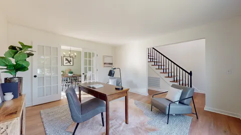 a view of a livingroom with furniture and lounge chair