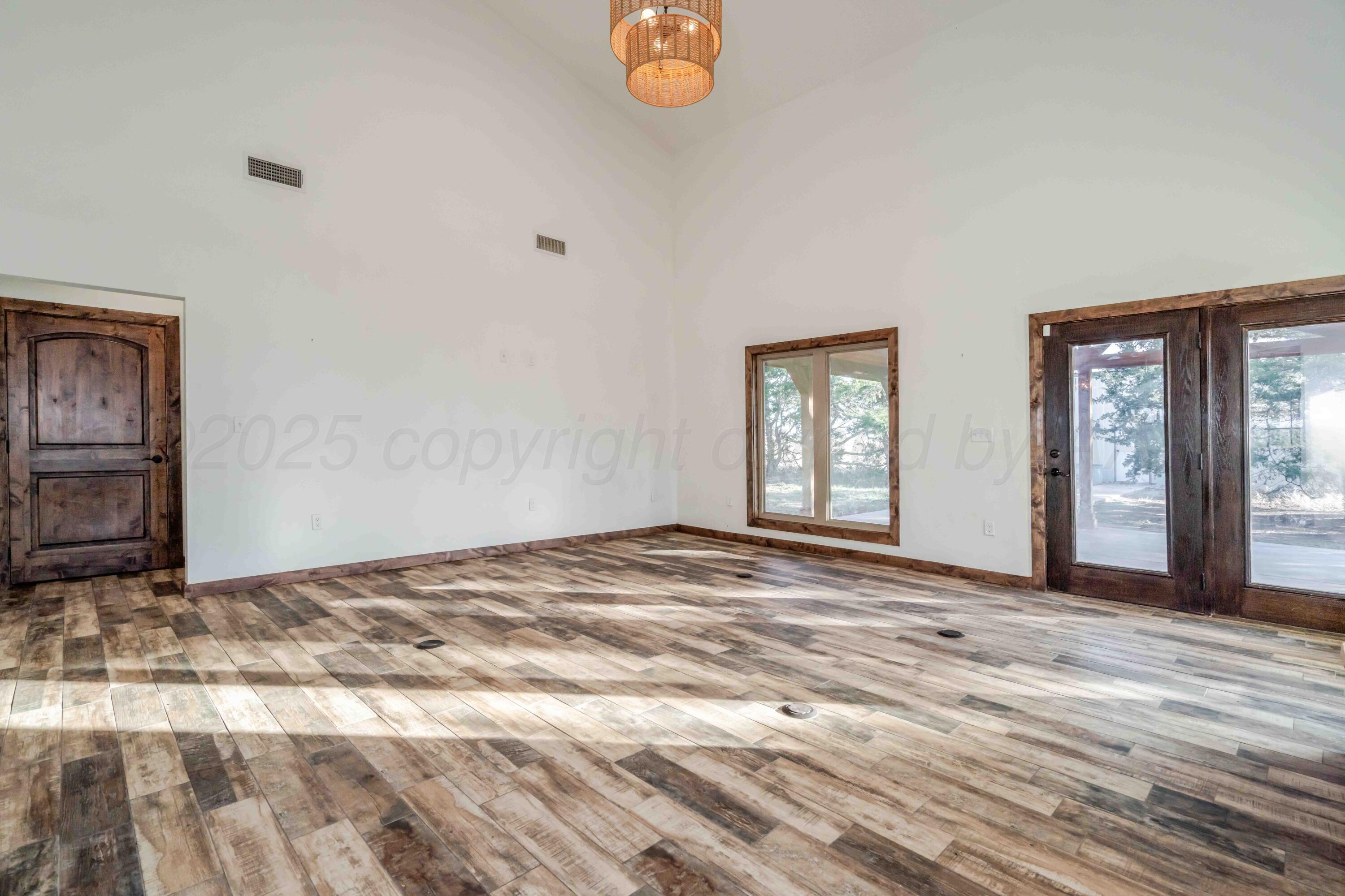 5490 West Rd R Dumas, TX 79029 - Photo 14 of 36 a view of empty room with window