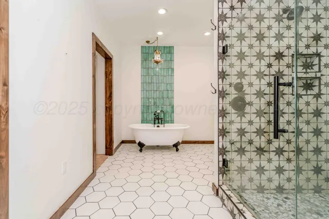 a bathroom with a granite countertop sink mirror and shower
