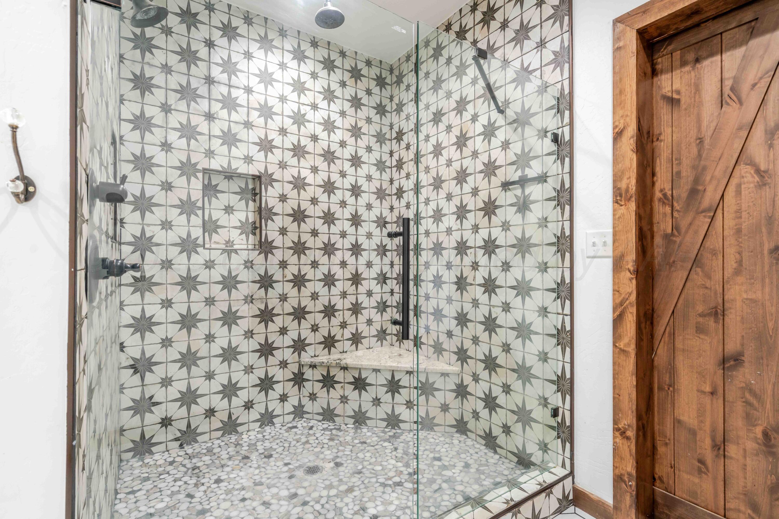 5490 West Rd R Dumas, TX 79029 - Photo 20 of 36 a bathroom with a shower