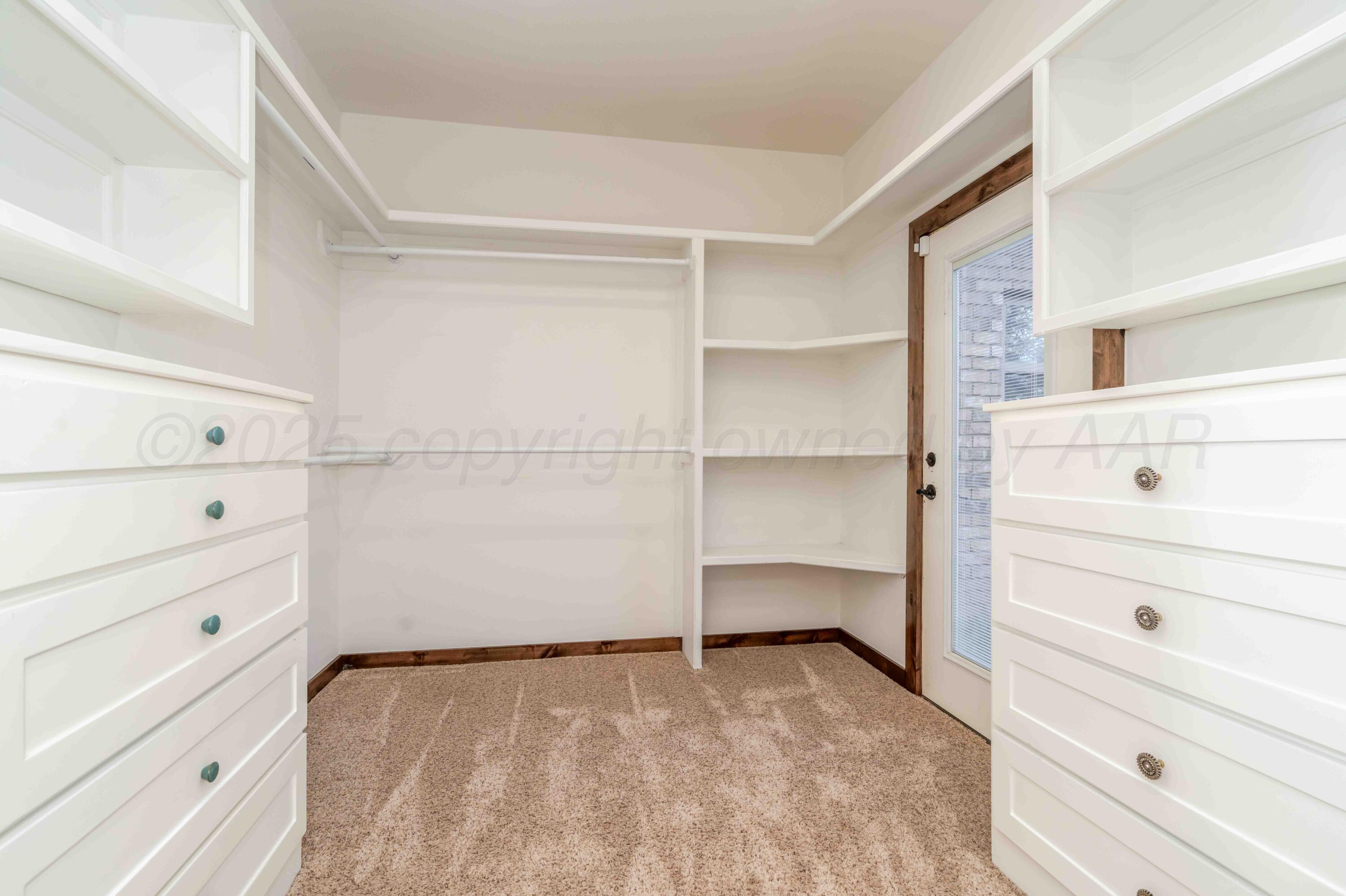 5490 West Rd R Dumas, TX 79029 - Photo 21 of 36 a view of an empty walk in closet