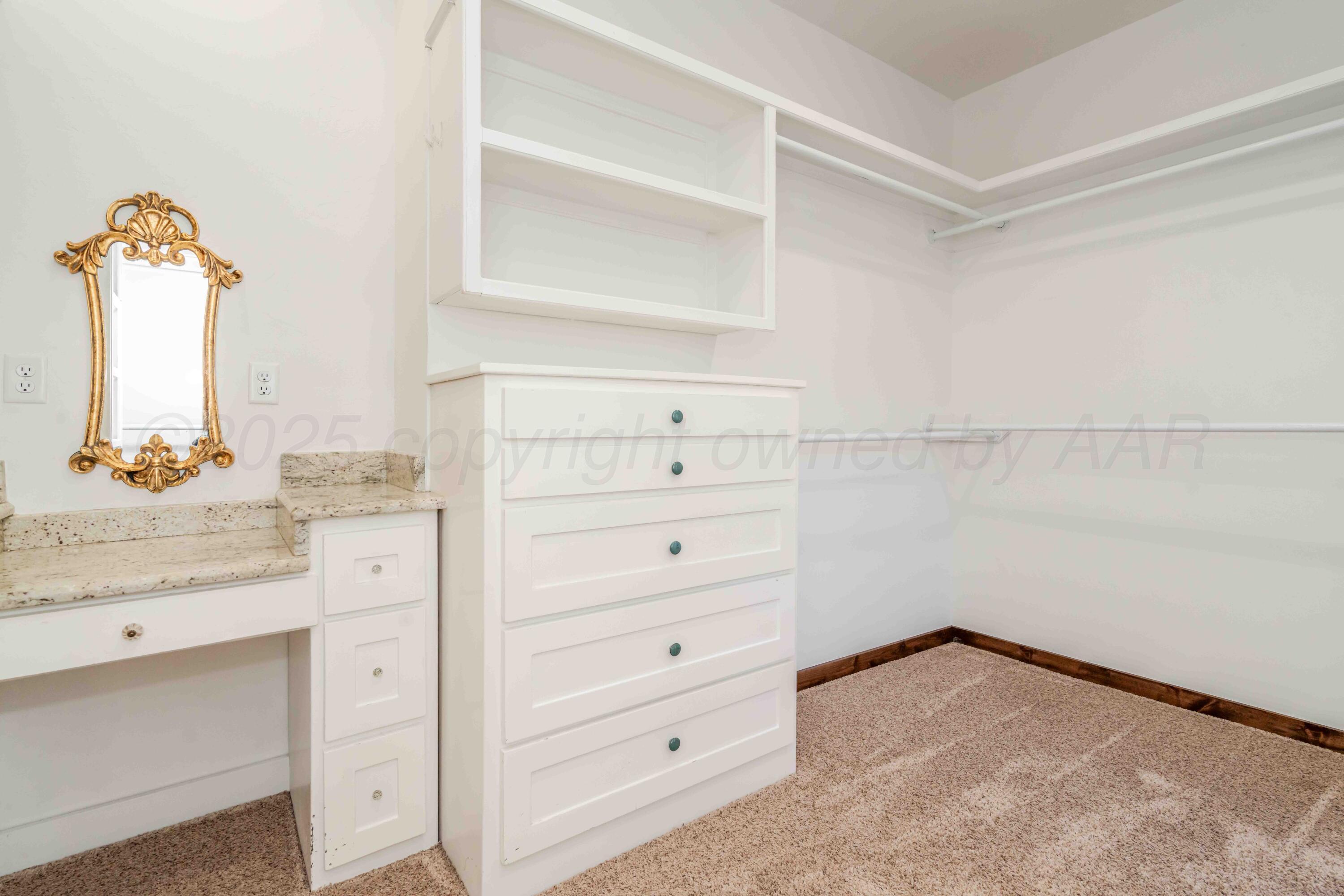 5490 West Rd R Dumas, TX 79029 - Photo 22 of 36 a bathroom with a sink vanity granite and a mirror