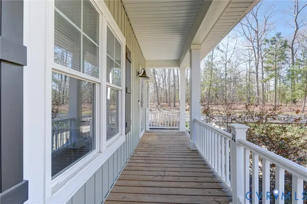 a view of a balcony with wooden floor