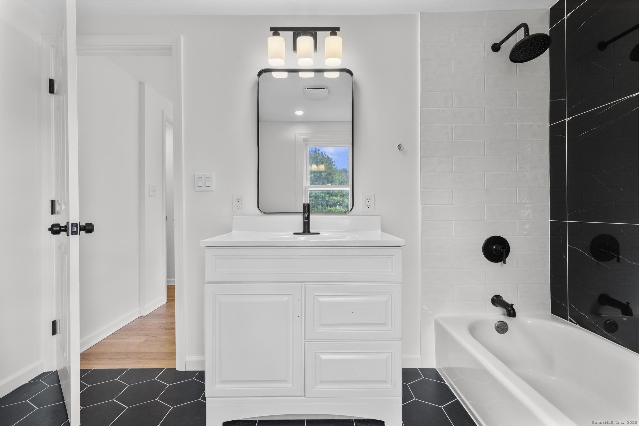 1092 Durham Road Guilford, CT 06437 - Photo 17 of 38 a bathroom with a bathtub and a sink