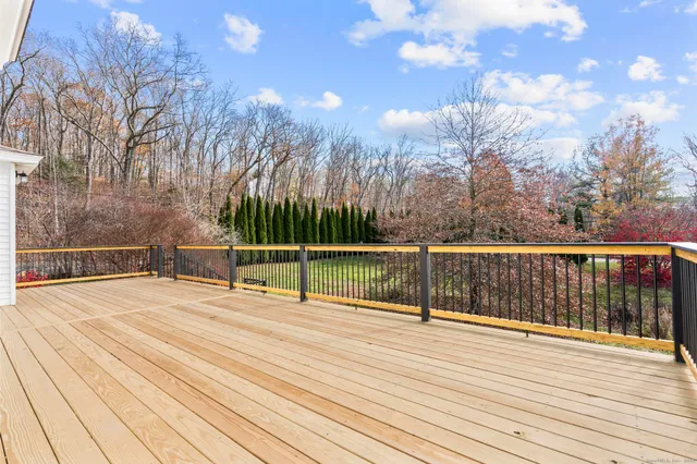a view of a patio with furniture and a yard