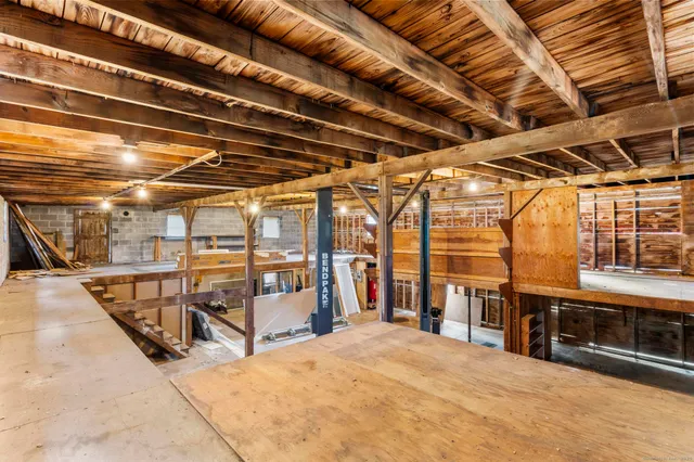 a view of a backyard with wooden fence