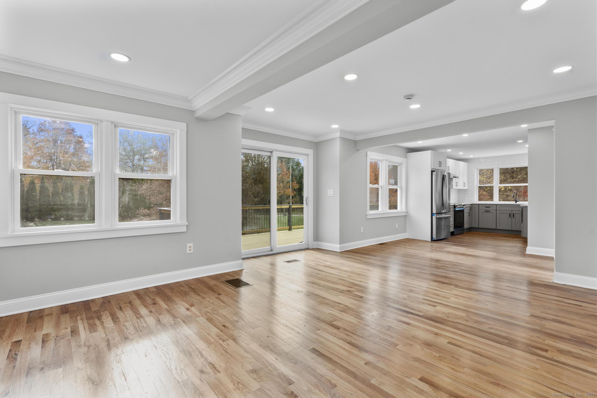 1092 Durham Road Guilford, CT 06437 - Photo 7 of 38 a view of empty room with wooden floor and windows