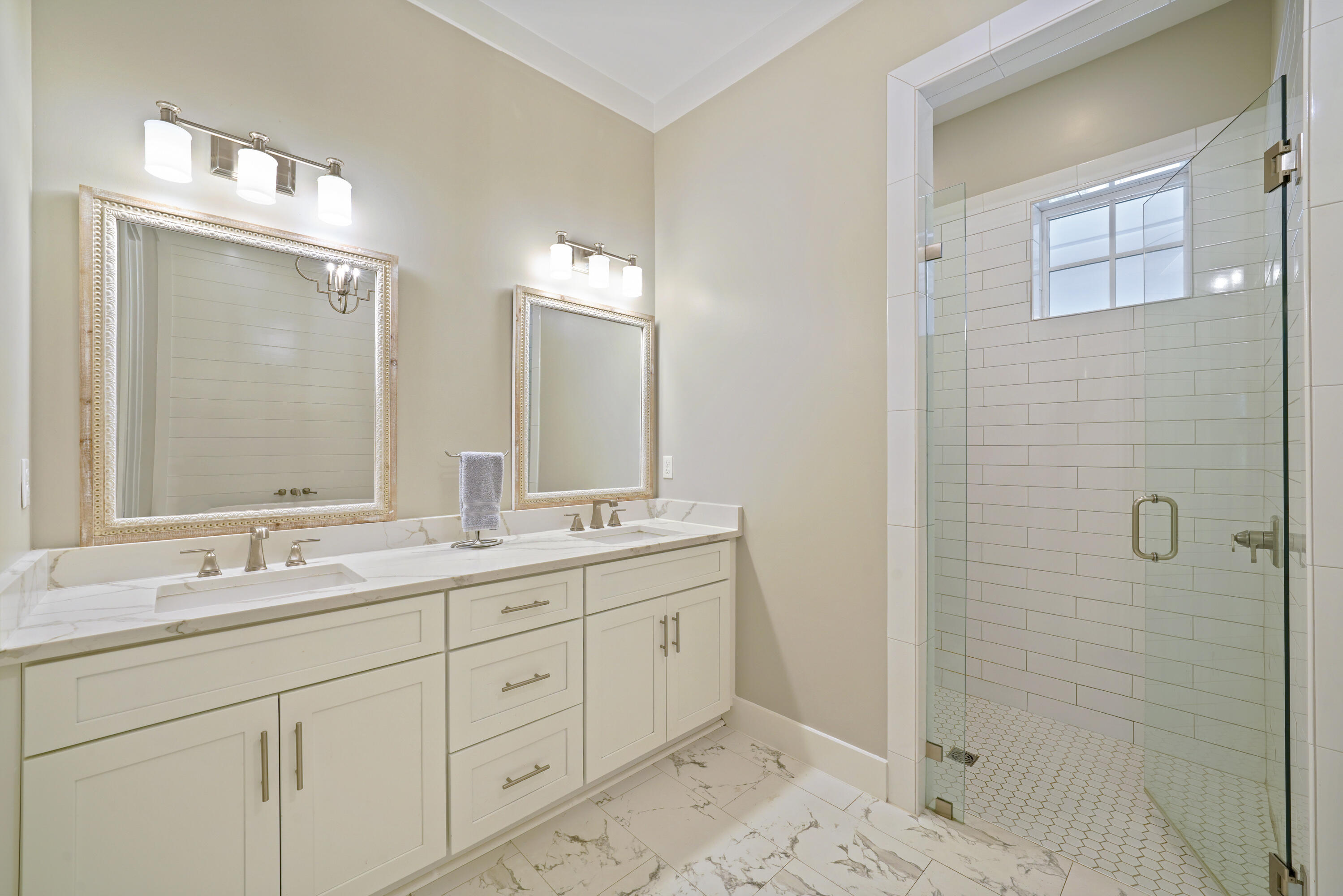 76 Tanglewood Drive Santa Rosa Beach, FL 32459 - Photo 14 of 29 a bathroom with a double vanity sink mirror and shower