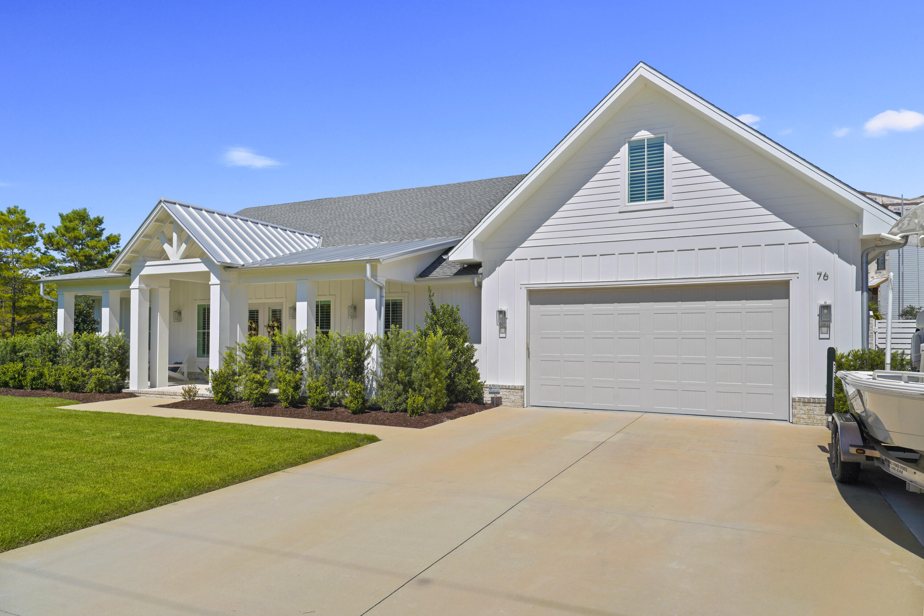 76 Tanglewood Drive Santa Rosa Beach, FL 32459 - Photo 2 of 29 a front view of a house with a garden and yard