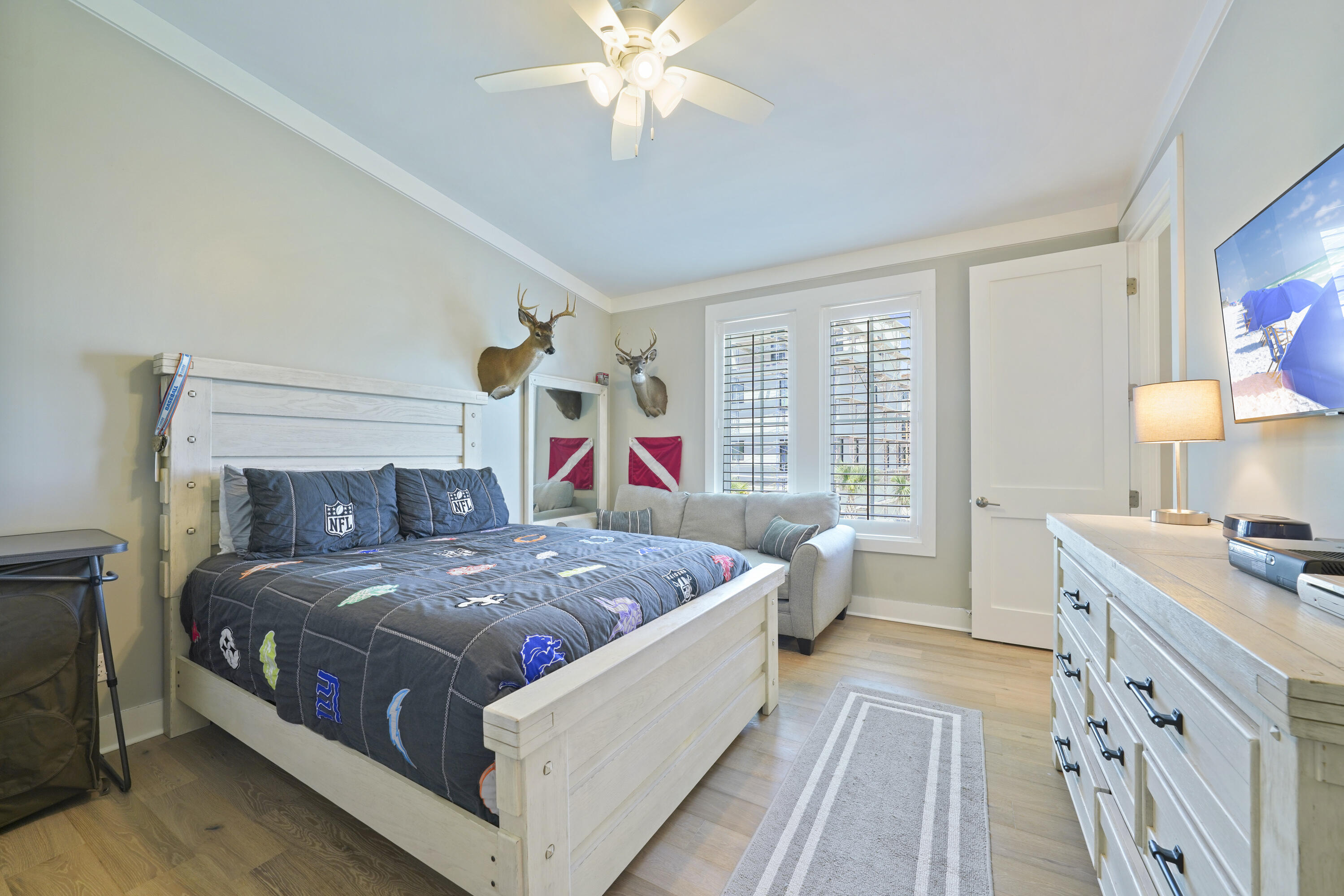 76 Tanglewood Drive Santa Rosa Beach, FL 32459 - Photo 28 of 29 a bedroom with a bed and a chandelier