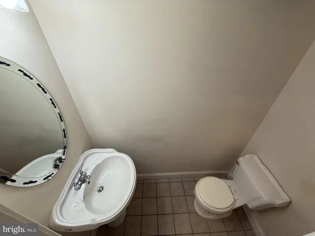 a bathroom with a toilet and a sink