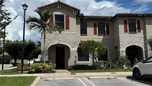 a front view of a house with yard
