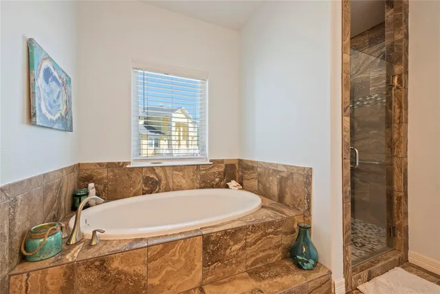 a bedroom with furniture and flat screen tv