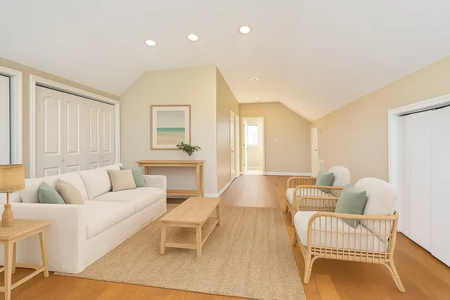 a balcony with furniture and a potted plant