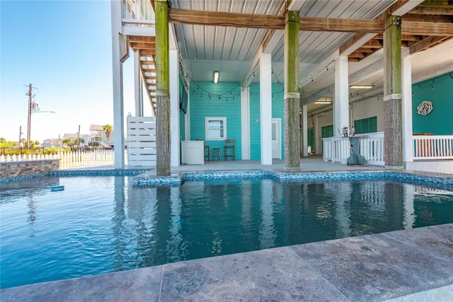 a view of a livingroom with furniture and hardwood floor