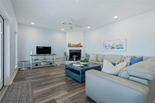 a kitchen with kitchen island granite countertop a sink appliances cabinets and counter space