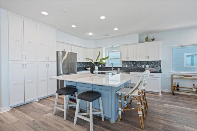 a bedroom with a bed and a ceiling fan