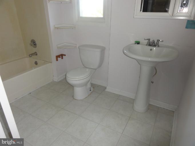 234 Baldwin Road Front Royal, VA 22630 - Photo 11 of 14 a bathroom with a toilet sink and shower