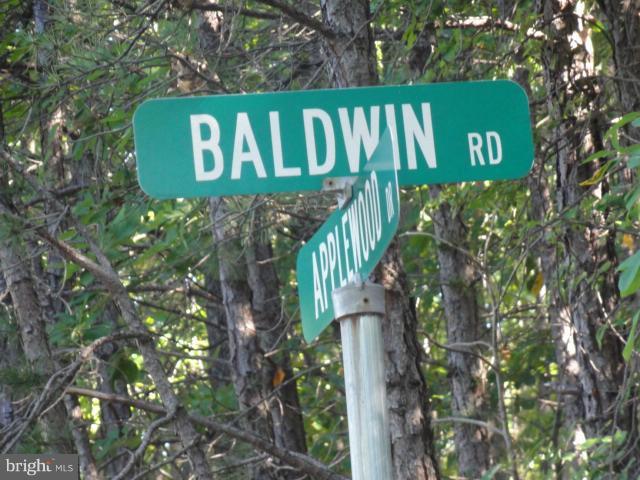 234 Baldwin Road Front Royal, VA 22630 - Photo 14 of 14 a sign that is on the side of a tree