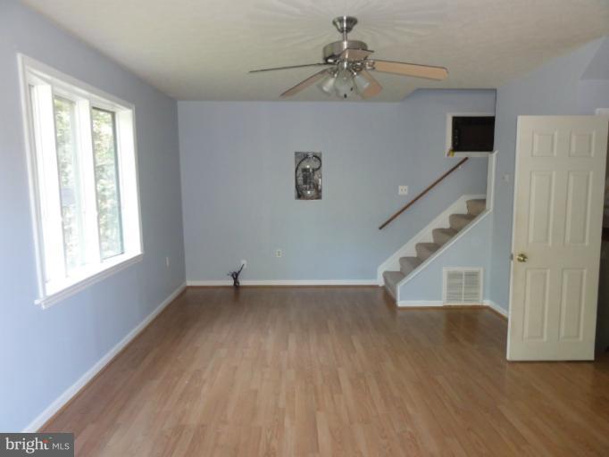 234 Baldwin Road Front Royal, VA 22630 - Photo 3 of 14 a view of an empty room with wooden floor and a window