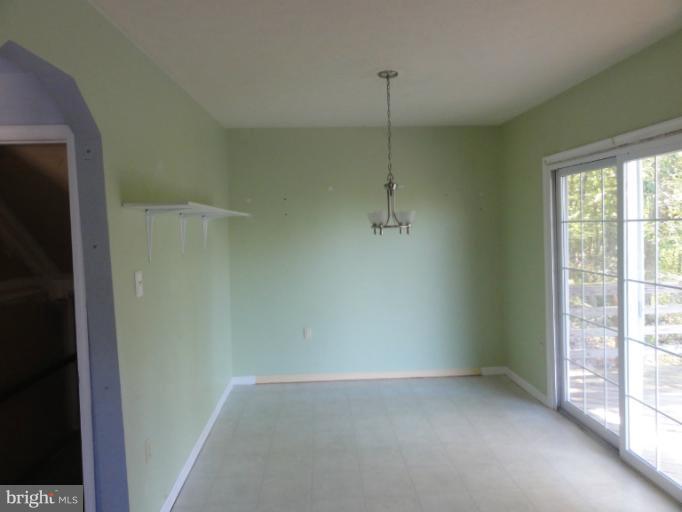 234 Baldwin Road Front Royal, VA 22630 - Photo 4 of 14 a view of an empty room with a window