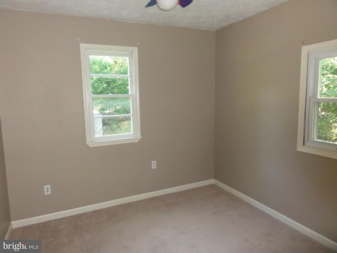 234 Baldwin Road Front Royal, VA 22630 - Photo 6 of 14 an empty room with a window