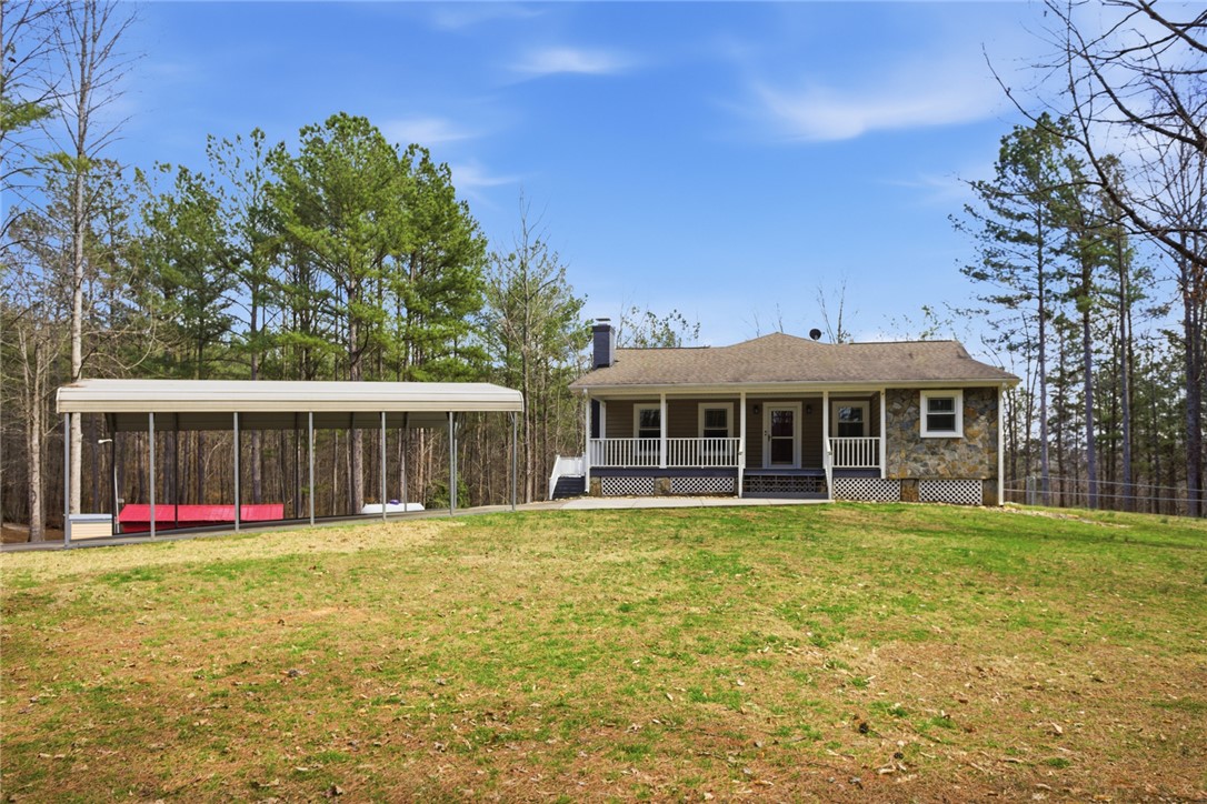 196 Flyroot Trail Pickens, SC 29671 - Photo 5 of 48 This inviting home offers comfortable living with a welcoming porch and expansive outdoor space.