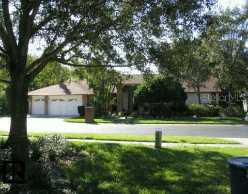 3029 Crest Clearwater Clearwater, FL 33759 - Photo 1 of 1 a white house that has a tree in it