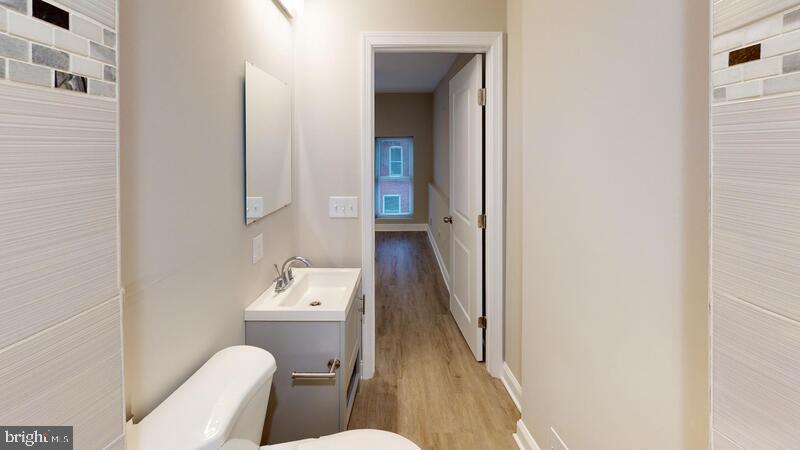 224 North Rose Street Baltimore, MD 21224 - Photo 6 of 14 a bathroom with a sink toilet and tub