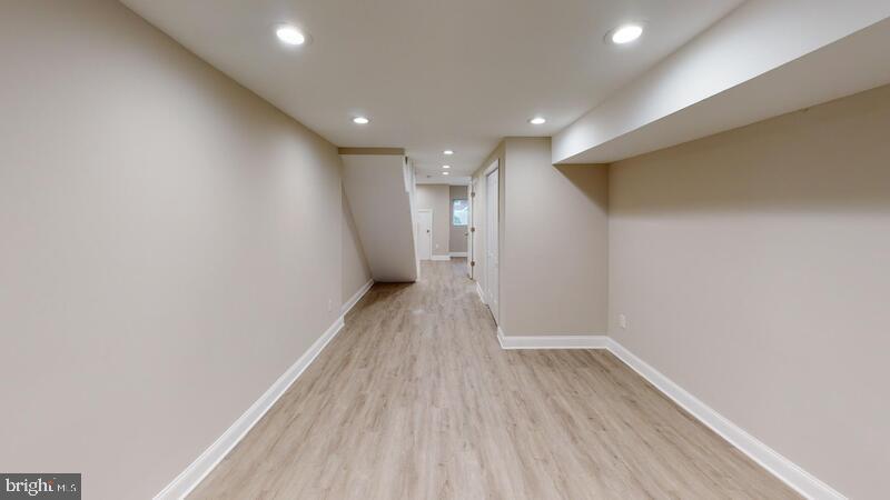 224 North Rose Street Baltimore, MD 21224 - Photo 7 of 14 a view of a room with wooden floor and window