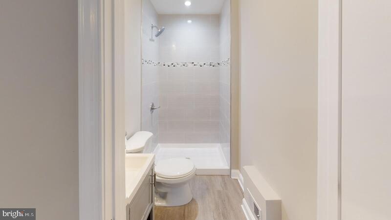 224 North Rose Street Baltimore, MD 21224 - Photo 8 of 14 a bathroom with a toilet and a shower