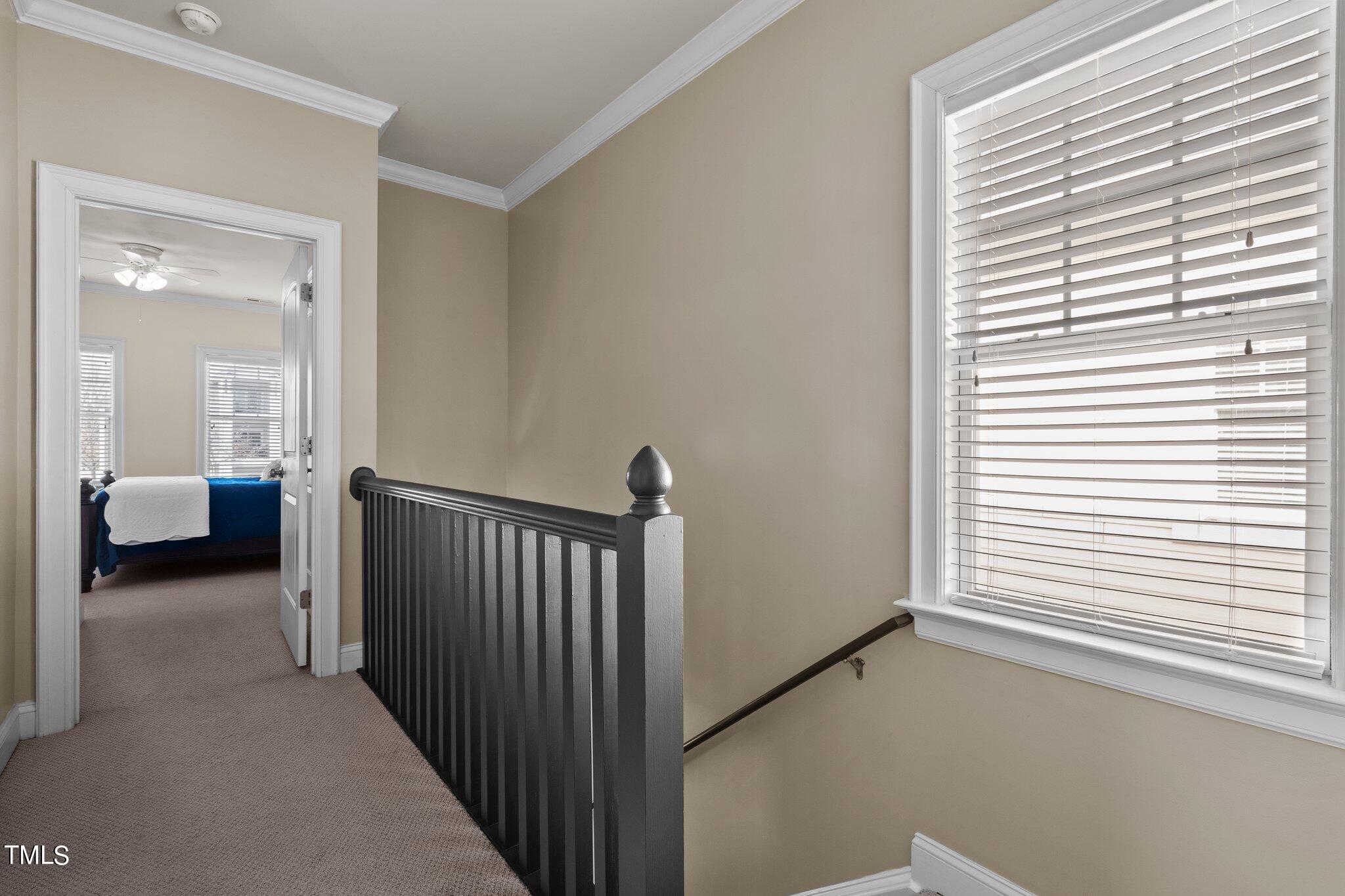 7765 Courtney Estates Drive Raleigh, NC 27617 - Photo 18 of 37 a view of a bedroom with furniture and windows