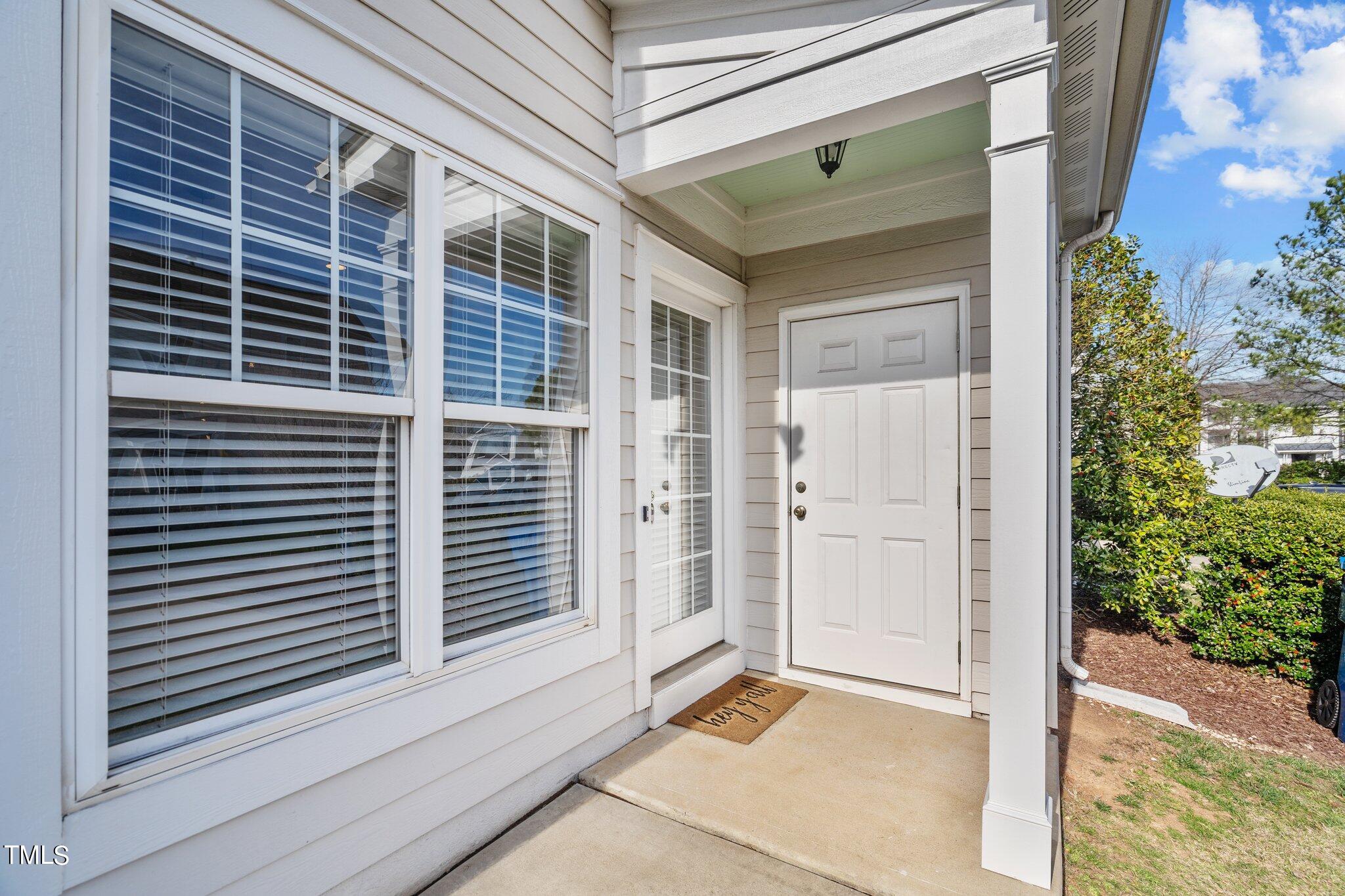 7765 Courtney Estates Drive Raleigh, NC 27617 - Photo 31 of 37 a view of front door and porch