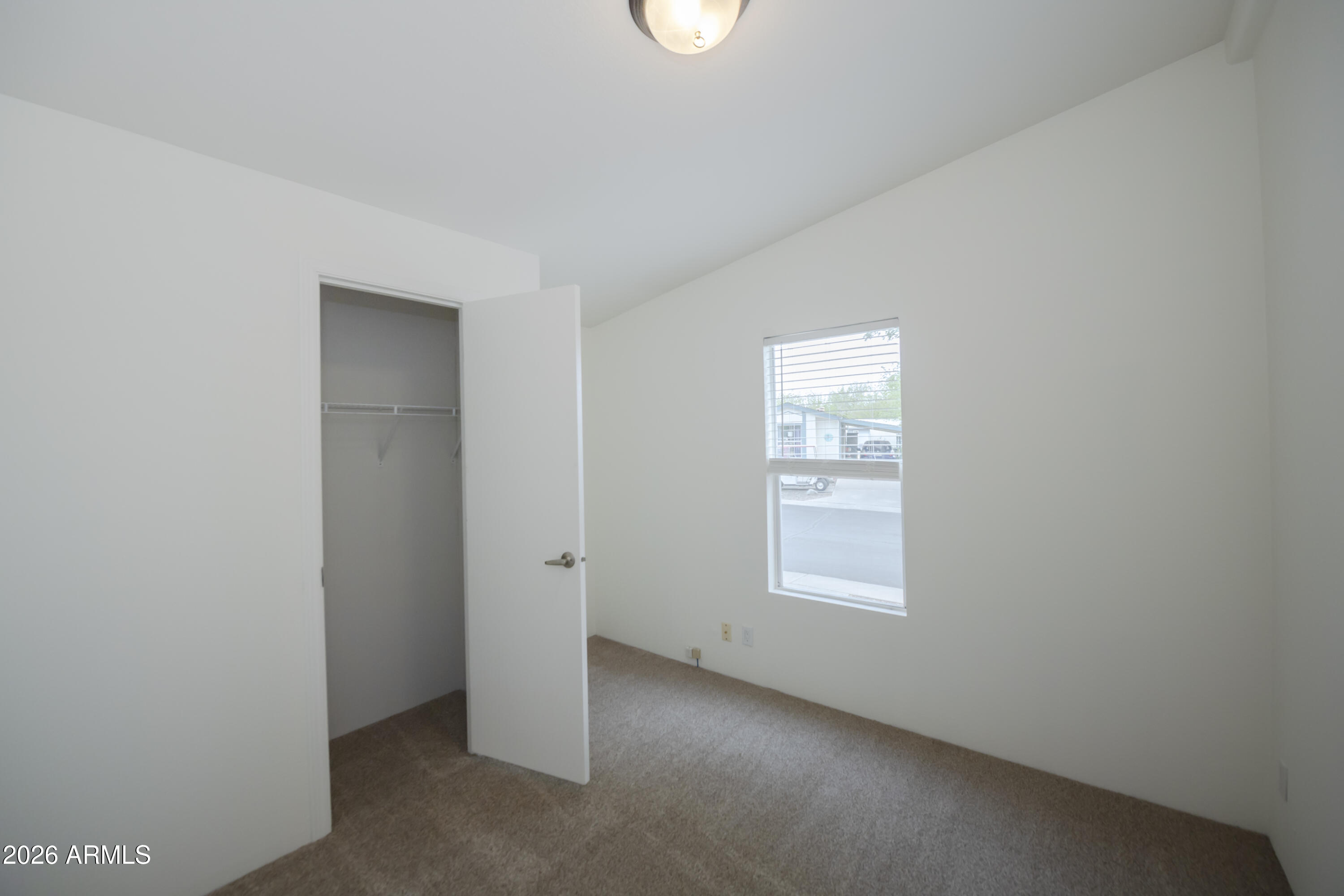 11250 East State Rte 69, Unit 1125 Dewey, AZ 86327 - Photo 28 of 45 an empty room with windows